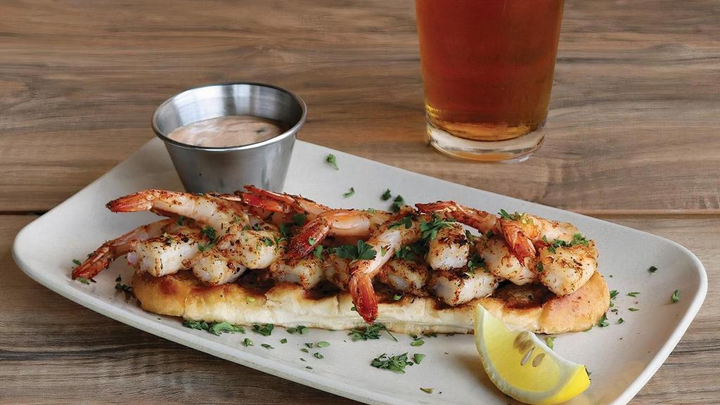 Char-Grilled Shrimp · Boldly marinated shrimp char-grilled & served on grilled garlic bread with house-made remoulade sauce