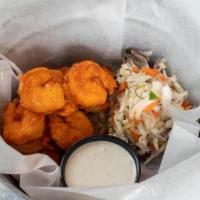 Buffalo Shrimp · fried shrimp tossed in Tin Lizzy’s hot sauce, blue cheese dressing