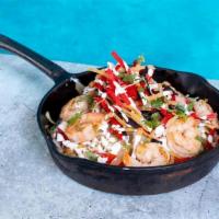 Shrimp Skillet · rice, grilled shrimp, jack cheese, grilled peppers and onions, tortilla strips, cilantro, li...
