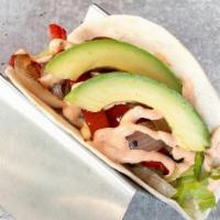 Fajita Taco · sliced avocado, grilled peppers and onions, romaine, spicy ranch.. add grilled or fried chic...
