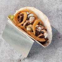 Executive Taco · grilled steak, lettuce, bleu cheese crumbles, fried onion straws, chipotle crema