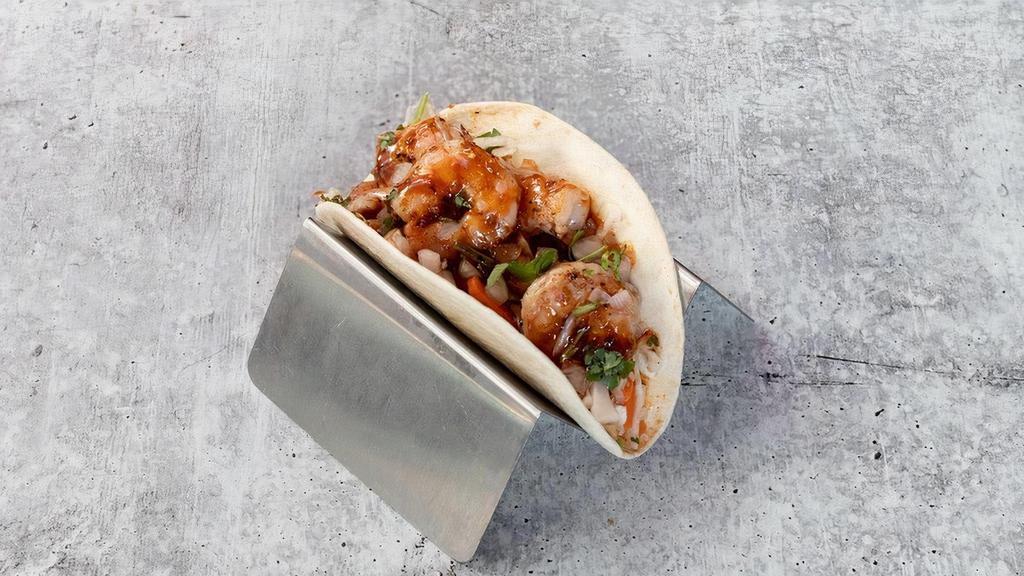 Korean Bbq Shrimp Taco · grilled shrimp, Asian slaw, Korean bbq sauce, cilantro & onions.