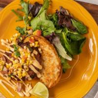 Crab Cake Appetizer · Our famous crab cake topped with chipotle lime mayo and roasted corn salsa.