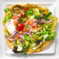 Taco Salad · Flour tortilla bowl with beans, cheese, mixed greens tossed in red chile vinaigrette, tomato...