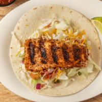 Baja Classic Fish Taco · Blackened mahi served on a soft flour tortilla With cabbage, pico de gallo, cheese, sour cre...