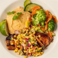 Ancho Honey Glazed Salmon · Grilled salmon with ancho honey, topped with roasted corn salsa with your choice of mashed p...