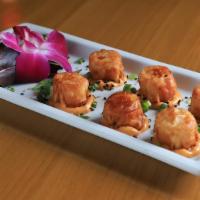 Shrimp Shumai · 6 pieces of fried shrimp dumpling.  Served with Aji panca sauce.