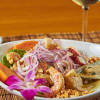 Mix Ceviche · Fresh raw diced wahoo, shrimp and octopus marinated in lime juice tossed with sliced red oni...