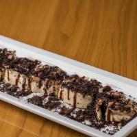 Cheesecake Roll · Roll shape dessert with cheesecake on the outside filled with strawberry, Nutella, guava cre...