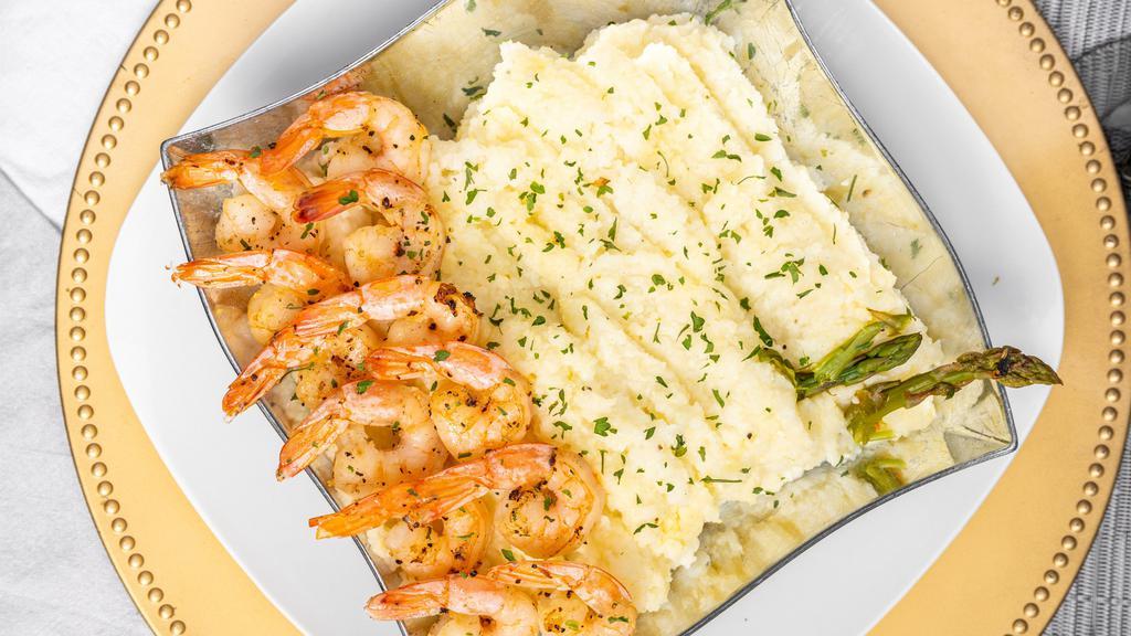 Shrimp & Grits Breakfast · Served with jumbo gulf sautéed shrimp and butter grits, topped with mixed cheese blend.