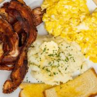 Country Breakfast · Served with two eggs, toast, bacon or sausage, and creamy butter grits turkey product availa...