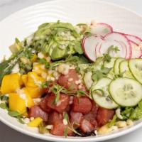 Ahi Tuna Poke Salad · Soy marinated ahi tuna, avocado, cucumber, radish, mango, mixed greens, macadamia nuts.
