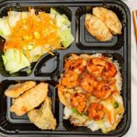 Hibachi Shrimp Bento Box · Served with house salad 2 pieces dumpling and 3 pieces vegetable tempura. comes with a choic...