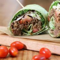Philly Wrap · Shaved ribeye, asiago cheese, spinach, mozzarella cheese and roasted vegetables.