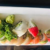 Rainbow Roll · Krab, cream cheese, cucumber, avocado inside with tuna, salmon outside and hamachi on top.