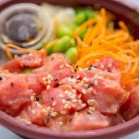 Spicy Tuna Poke Bowl · Spicy tuna, edamame, carrot, ginger, and sesame seeds. Served on a bed of sushi rice.