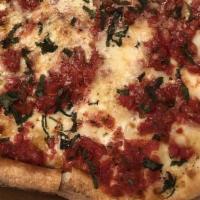 Grandma'S Pizza · Fresh plum tomatoes, mozzarella cheese, basil, garlic, and olive oil.