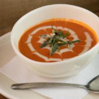 Tomato Bisque · Crème fraiche, seasoned with onions and finished with a hint of basil.