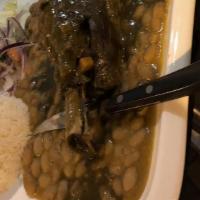 Seco De Cordero · Lamb shank, cilantro sauce, lima beans, white rice, fried cassava, criolla salad.