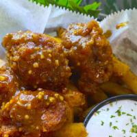 Fried Cauliflower  Basket · Roots Popcorn Chickin seasoned to perfection covered  with your choice of sauce and side of ...