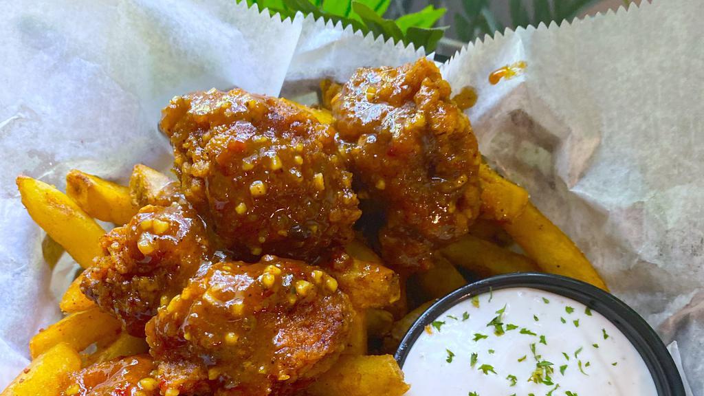 Fried Cauliflower  Basket · Roots Popcorn Chickin seasoned to perfection covered  with your choice of sauce and side of fries. . Soy-free