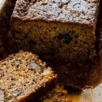 Banana Bread Slice · Moist and delicious, classic banana nut loaf, filled with crunchy walnuts and sweet overripe...