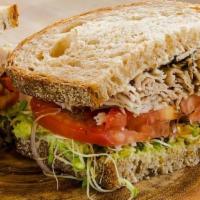 Peppered Turkey Sandwich · Smoked peppered turkey, sprouts, avocado, red onion, tomato, grainy mustard & mayonnaise, on...