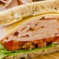 Smoked Turkey Sandwich · Smoked turkey, lettuce, tomato, swiss cheese, grainy mustard & mayonnaise on house-made rye ...