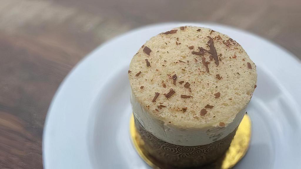 Tiramisu Chocolate Ind. · A bottom layer of chocolate cake topped with silky chocolate mousse, a genoise layer soaked with espresso and rum and covered with mascarpone cream.