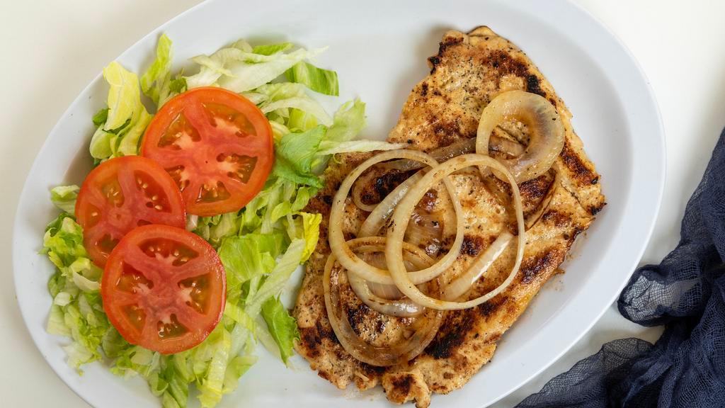 Filete De Pollo (Chicken Fillet) · Flattened chicken breast marinated cuban style. Cooked until golden and topped with sauteed onions.