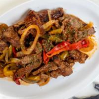Filetillo De Res (Pepper Steak) · Juicy steak strips perfectly marinated in bell peppers, garlic and onions.