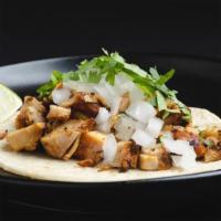 Pollo Asado Taco · tangy achiote-rubbed grilled chicken, cilantro, onion