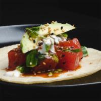 Tuna Cruda Taco · yellowfin tuna*, kimchee sauce, cucumber, sliced avocado, cilantro, fresh jalapeños, cumin-l...