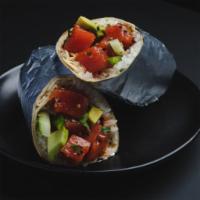 Tuna Cruda Burrito · cilantro-lime rice, yellowfin tuna*, kimchee sauce, cucumber, sliced avocado, cilantro, fres...