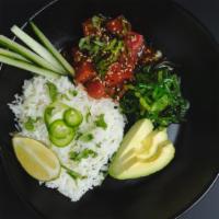 Tuna Cruda Bowl · cilantro-lime rice, yellowfin tuna*, kimchee sauce, cucumber, sliced avocado, cilantro, fres...