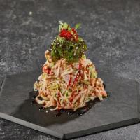Crab Salad · Kani stick, tuna, salmon, wakame, Japanese mayonnaise, tobiko, eel sauce.