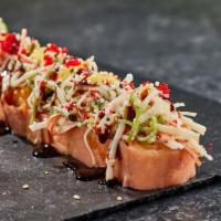 Salmon Special Roll · Tempura shrimp, avocado, cream cheese, wrapped with smoke salmon and crab salad on top.