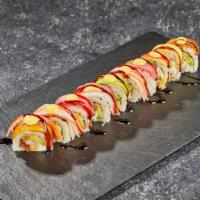 Rainbow Roll · Tempura Shrimp, avocado, cream cheese, kanikama crispy, topped with tuna, salmon, kanikama, ...