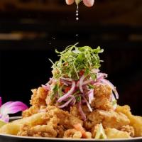 Jalea De Mariscos · Deep fried corvina, calamari, octopus, mussels, shrimp, yuca and tartar sauce.