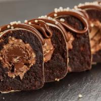 Ferrero Rocher Brownie Roll · Brownie , ferrero Rocher with Nutella topping.