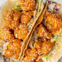 Firecracker Shrimp Taco · Our famously fried shrimp is tossed in sweet'n'spicy firecracker sauce over garlic ginger sl...