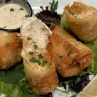 Cajun Seafood Eggrolls · salmon, crab, shrimp, monterey jack, boursin, rolled and fried crisp served with creole must...