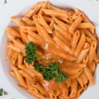 Penne Alla Vodka · Sautéed in our roasted garlic and basil, pink Vodka sauce. Delicious.