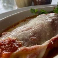 Lasagna · Baked & Mouthwatering Layers of homemade pasta, homemade Meat-sauce, Mozzarella, Ricotta & P...