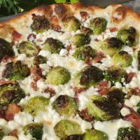 Brussels Sprouts & Bacon Pizza  · oven roasted brussels sprouts, applewood smoked bacon and crumbled goat cheese