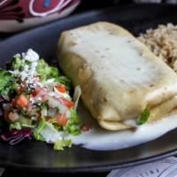 Chimichanga · Rolled and golden fried tortilla stuffed with refried beans and choice of filling. Sauced wi...