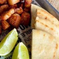 Chicharron Y Arepa · Fried pork belly pieces served with lime and Arepa