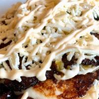 Tajadas By Guru · Fried plantains with grilled cheese in between, topped with Nata (cream) and shredded Queso ...