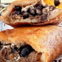 Empanada Pabellon · {shredded beef, fried plantain, black beans and organic white cheese empanada}