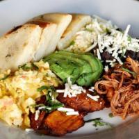 Desayuno Criollo * · Shredded beef, black beans, fried plantains with white shredded cheese, avocado and scramble...
